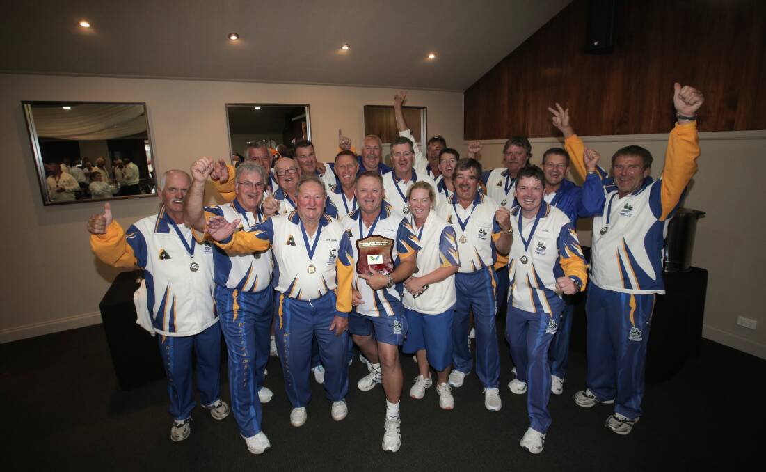 Warrnambool Gold team members celebrate their division one victory on Saturday. 