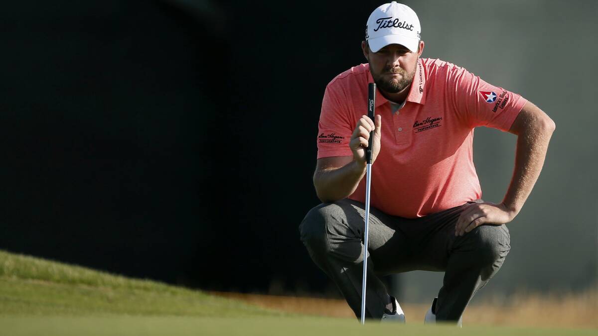 Marc Leishman studies a putt on the sixth green. 
Picture: REUTERS