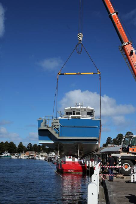 Three years after it started taking shape on the Pender family farm at Timboon, the Southern Explorer was yesterday gently lowered into the Moyne River at Port Fairy. 140902RG29  Picture: ROB GUNSTONE
