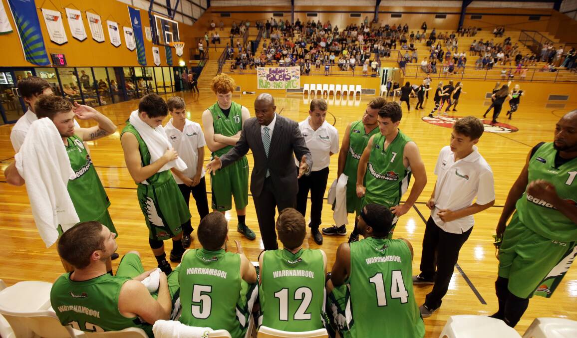 Warrnambool Seahawks coach Bobby Cunningham, addressing his players on court, has been central to their rapid development. 140405DW100 Picture: DAMIAN WHITE