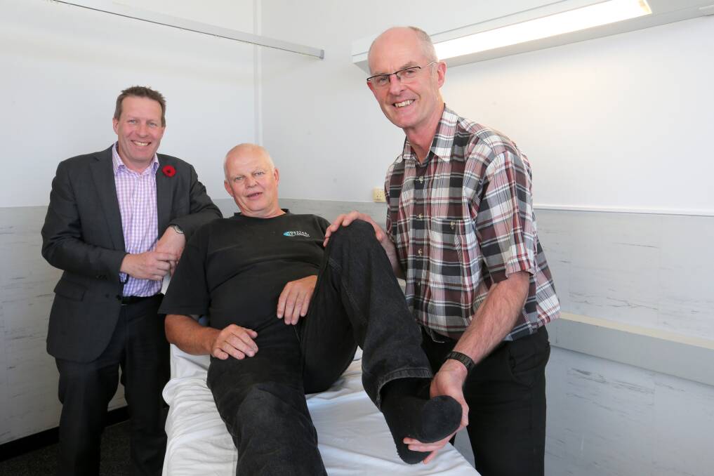 At the PAR Clinic are (from left) orthopaedic surgeon Alasdair Sutherland, hip replacement patient Gary Batten and physiotherapist Tony Pritchard. 141111RG02 Picture: ROB GUNSTONE