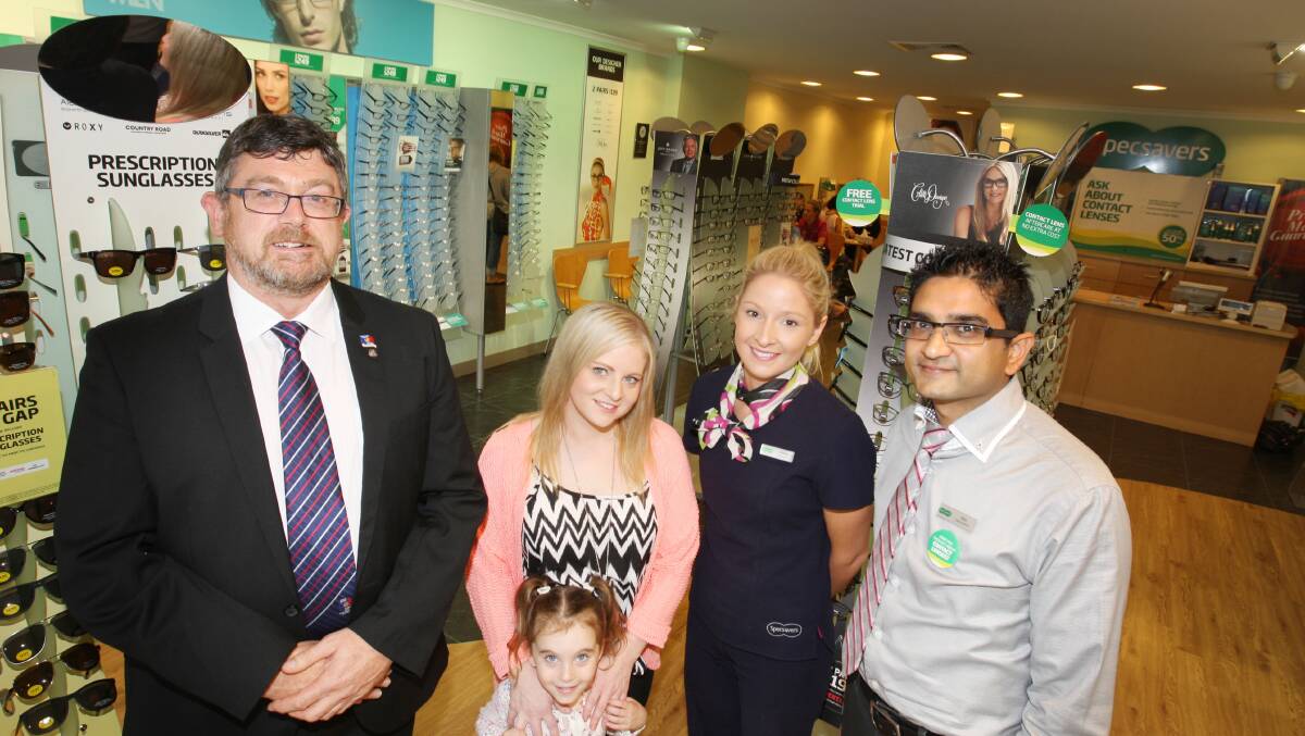 Warrnambool Daybreak Rotary Club president Ian Watson (left) with Lisa Hyder and daughter Lainie, 4, with Warrnambool Specsavers manager Jesse Williamson and optometrist Mehul Patel.