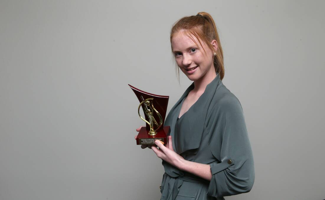 Merrivale’s Nicole Sandow with the reward for her seven-vote 15 and under award win. 141813AS26 Picture: AARON SAWALL