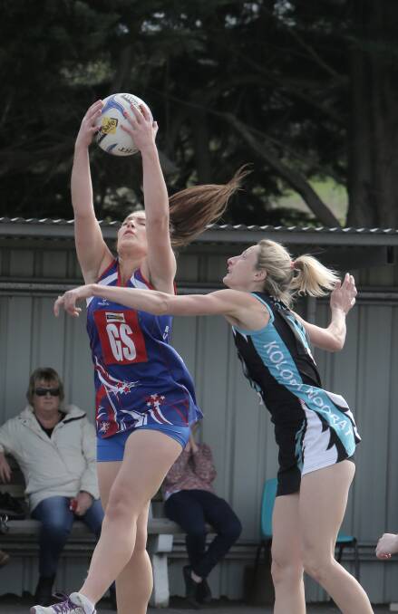 Panmure goal shooter Eleanor Wright wins an aerial contest with Kolora-Noorat’s Kelly Mullen, who later suffered a head injury. 