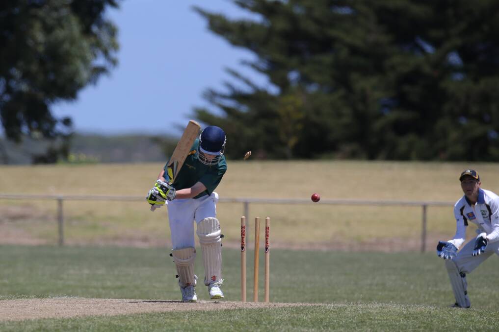 West Wimmera batsman Billy King hears the sound of leather on wood, but not the way he would have liked. Warrnambool Blue wicketkeeper Harrison Bond likes what he sees.150105AS22 Pictures: AARON SAWALL