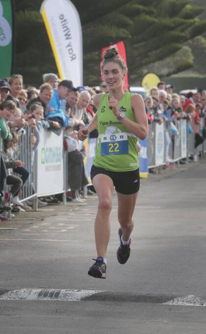 Virginia Moloney stretches out to win the women’s section of the 10km race.     150111AM36    Picture: ANGELA MILNE