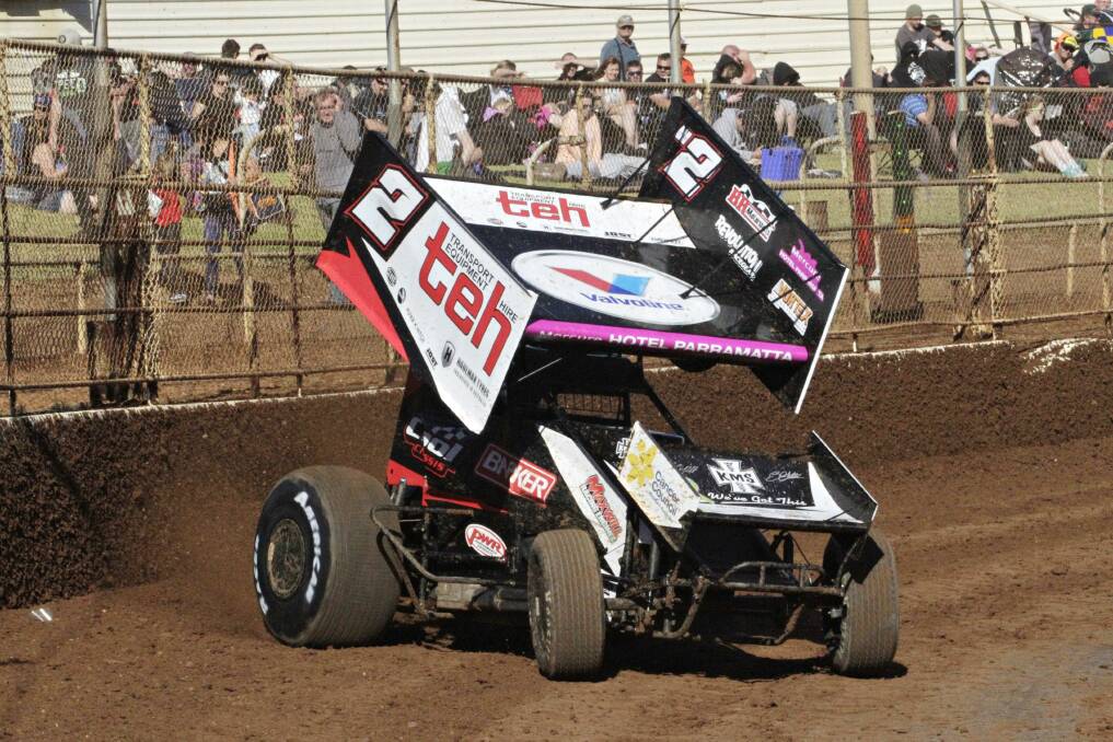 Brooke Tatnell powers out of a high slide. Picture: Stephen Pickering, SprintcarZone