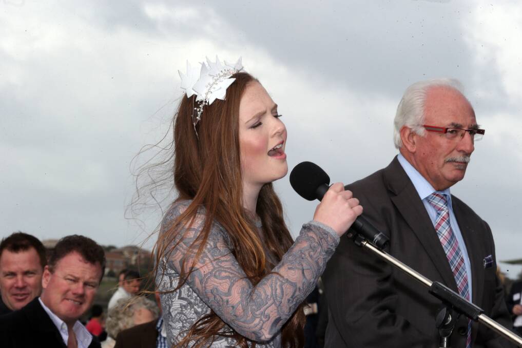 Grace Laing wows racegoers with her rendition of the national anthem on course yesterday. 150507DW56 Picture: DAMIAN WHITE