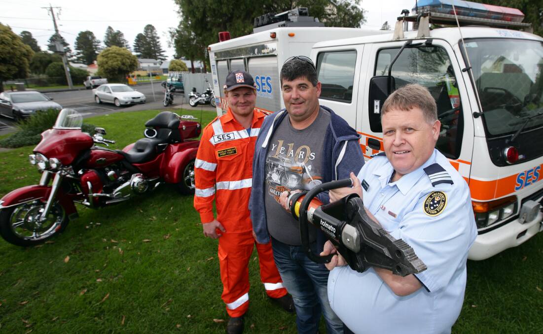 Accident victim Peter Mahony (centre) donated $10,000 to the Port Fairy SES, which was used to buy the combined cutter/spreader received by SES controller Stephen McDowell (right) and SES member Nicholas Seekamp. 