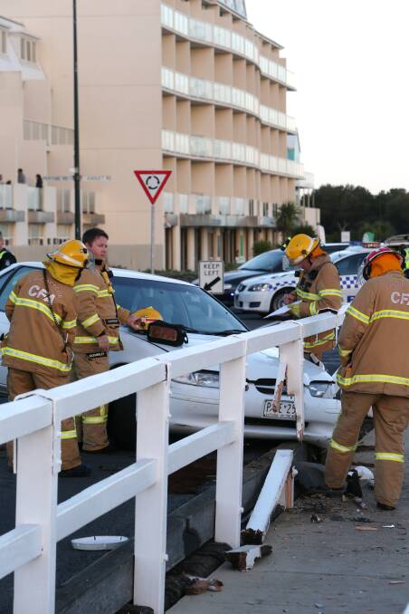A car which crashed into the Stanley Street bridge was abandoned by its occupants.