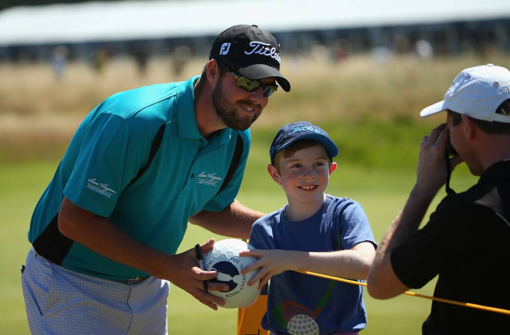 Marc Leishman accommodates a young fan’s wish for a photograph during a practice round at Royal Liverpool. Picture: GETTY IMAGES