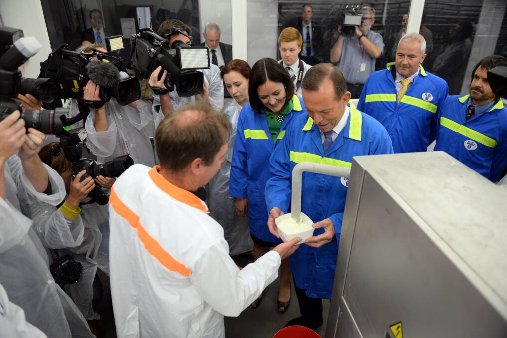 Spruiking the benefits of free trade agreements for the dairy industry, Prime Minister Tony Abbott tours Bulla Dairy Foods factory in Colac with Corangamite MP Sarah Henderson. Picture: THE AGE