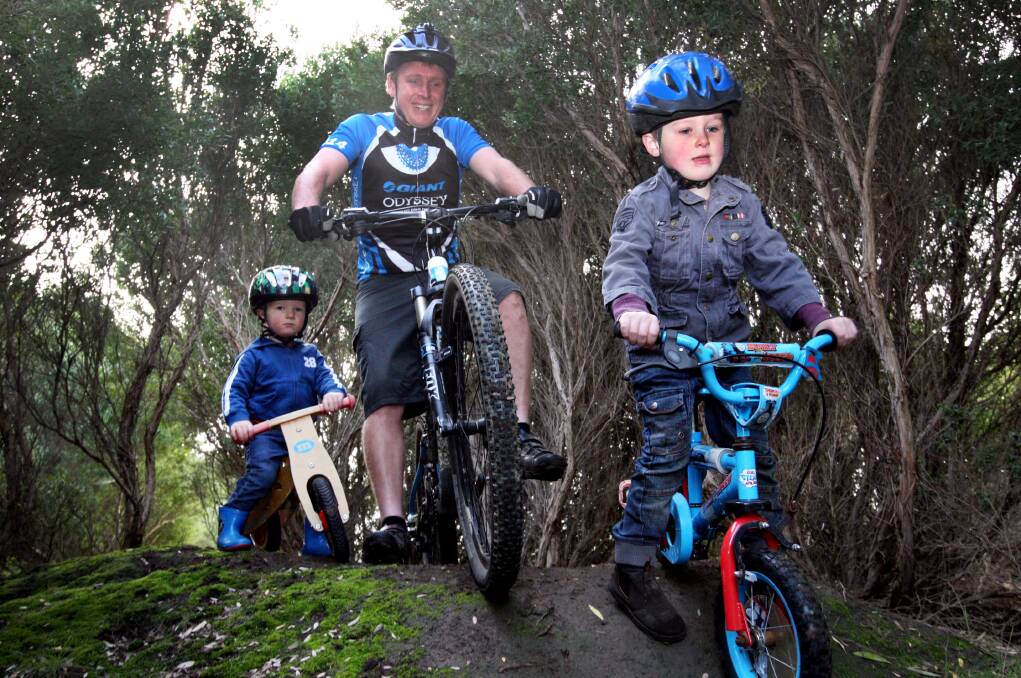 Four-year-old Thomas Dufty leads his dad Leigh and brother Jacob, 2, in training for tomorrow’s Warrnambool Mountain Bike Club winter series opening event. 