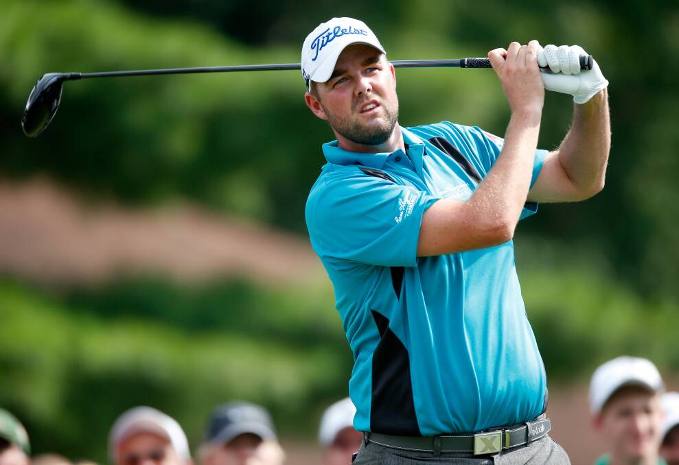 Marc Leishman powers off the eighth tee during the final round of the World Golf Championships Bridgestone Invitational in Akron, Ohio. He finished third to pocket more than $US520,000.  Picture: GETTY IMAGES/AFP