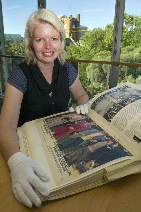 University of Melbourne Archives’ Melinda Barrie with one of the collection items in the Baillieu Library reading room.