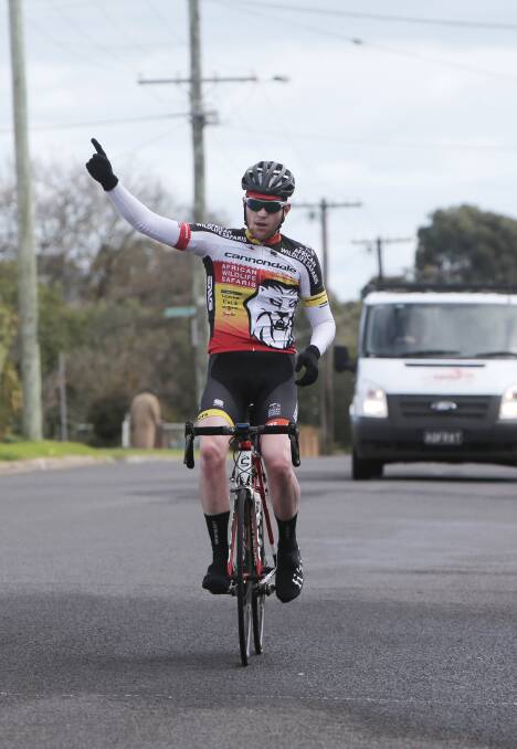 Brunswick cyclist Nathan Elliott makes the transformation from runner-up to victor in the Victorian 100km road championship yesterday in Hamilton.   140706AM33 Picture: ANGELA MILNE