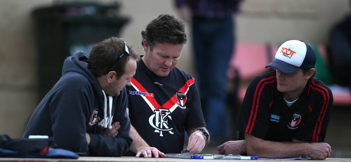 Koroit’s 2014 assistants Mathew Buck (left) and Andrew Paton (right) flank senior coach Adam Dowie. 140517DW60 Picture: DAMIAN WHITE