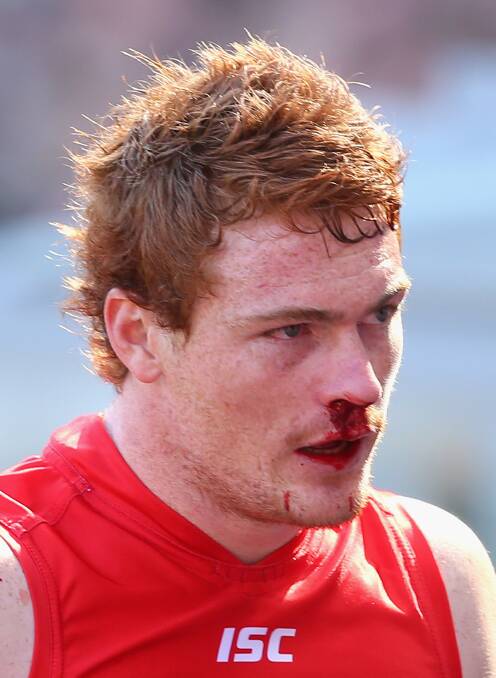 Gary Rohan exits the field with a blood nose during the grand final. Picture: Getty Images