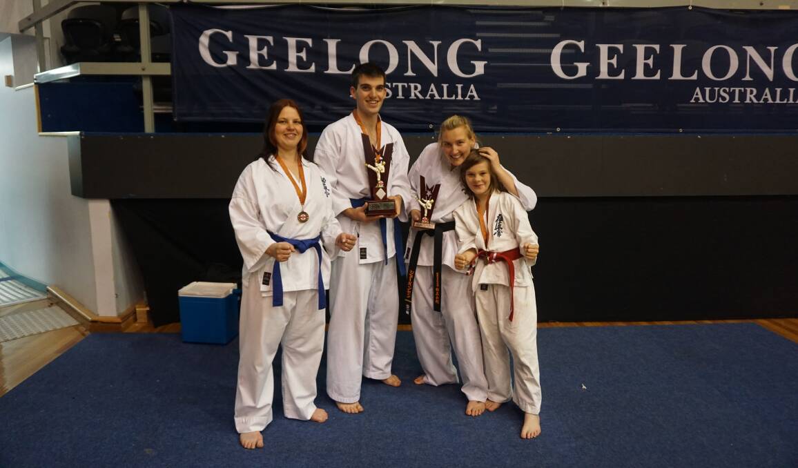 Warrnambool Kyokushin Karate Club members (from left) Serina Bogers, Riley McDonald, sempai Natalie Jorgensen and Hayden Lakey after state titles competition in Geelong.