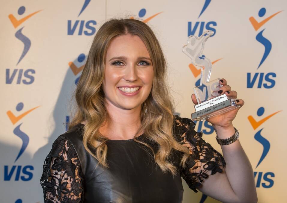 Melissa Tapper with her Victorian Institute of Sport elite athlete with a disability award. Picture: Mark Dadswell