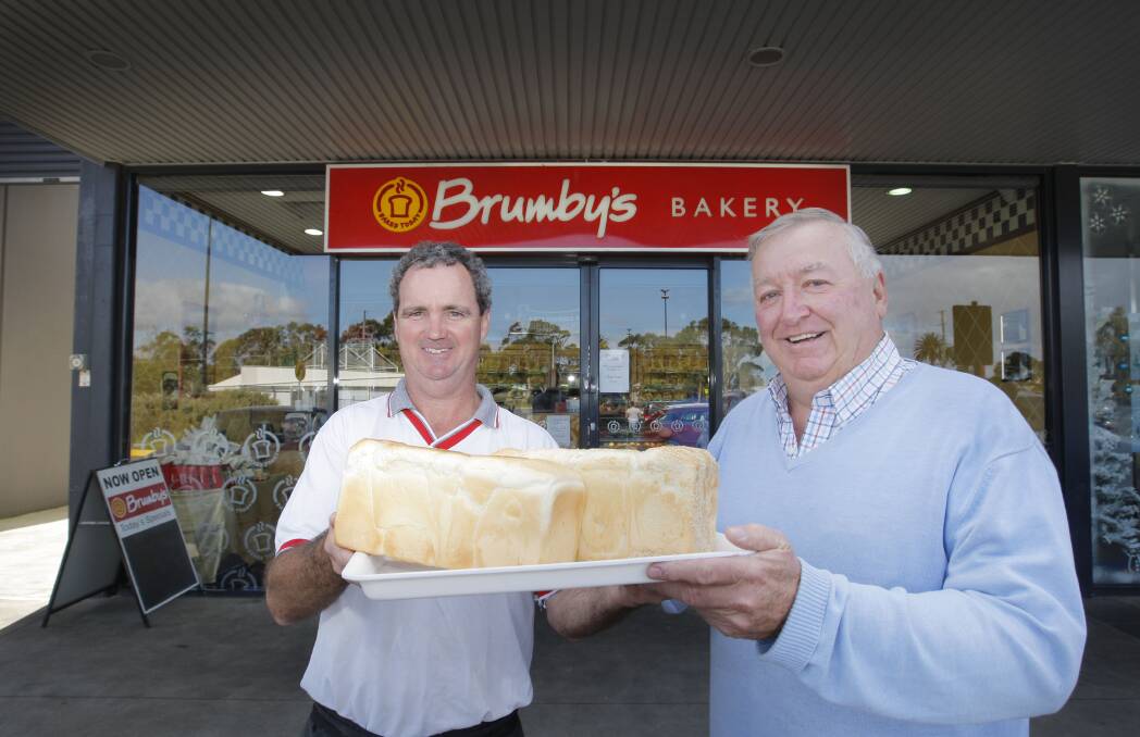 Brumby’s Bakery owner David McMahon (left) and St Vincent de Paul represent-ative Chris Nolan are helping families in need.    141219AM01 Picture: ANGELA MILNE
