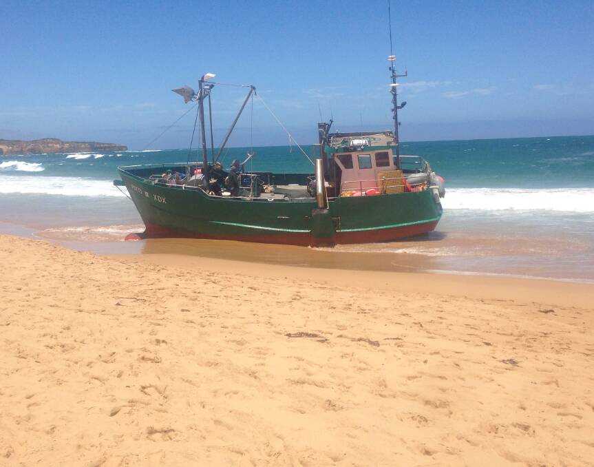 A cray boat sits stuck fast on the beach at Peterborough after dragging anchor and washing ashore yesterday.