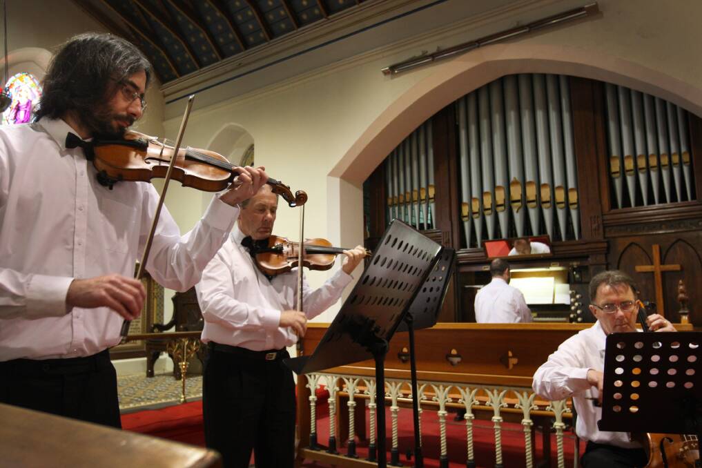 The string and organ combination of Chris Philpot (left), Phillip Trigg, Craig Doherty and Mike Weise perform at Christ Church Anglican Church on Saturday afternoon. Picture: LEANNE PICKETT