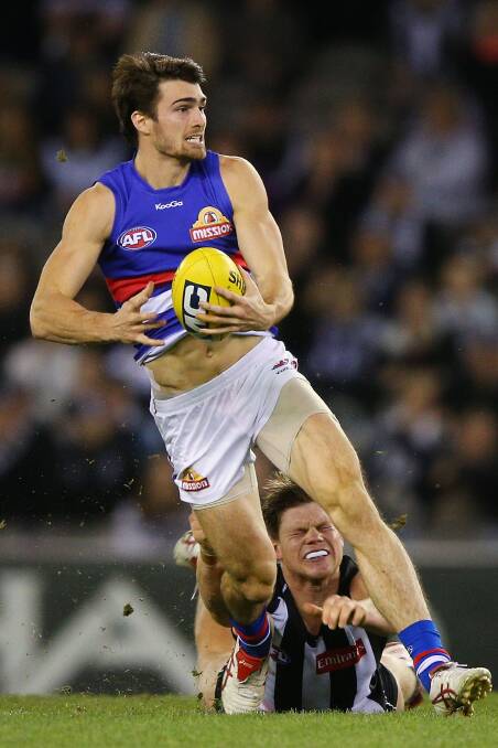 Easton Wood in barnstorming action against the Magpies in round 13. Picture: Getty IMAGES
