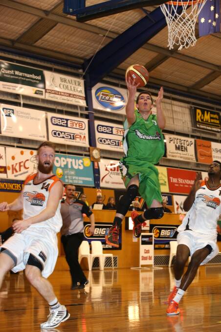 Damian Gray leaps high to score during Saturday night’s 100-91 victory over Big V leader  Latrobe Valley Energy at the Arc. 
