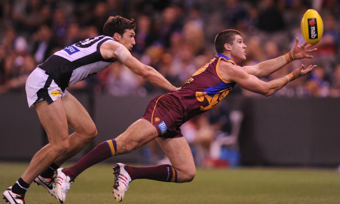 Jonathan Brown (right) in action against Carlton defender Michael Jamison at Docklands stadium. Picture: FAIRFAX