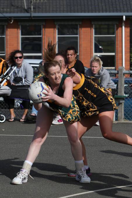 Old Collegians’ Rachel Alderson protects the ball under pressure from Merrivale opponent Jess Brereton. Pictures: AARON SAWALL