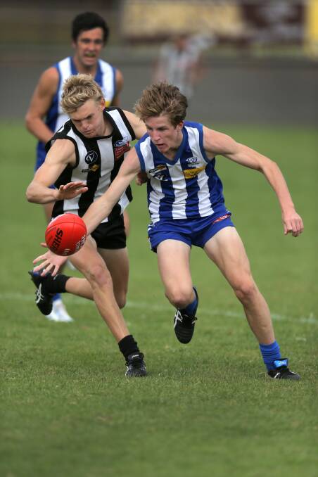 Hamilton Kangaroos youngster Sean Barnes is first to the ball against Camperdown rival Jake Dowell in the HFNL pre-season competition on Saturday. 150328RG25 Picture: ROB GUNSTONE