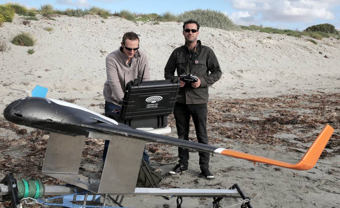 Director Mathew Herbert (left) and flight controller Leon Dwyer set the drone for a flight over Lady Bay.