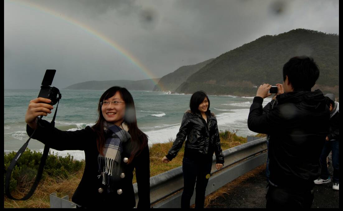 Chinese tourist Paulina Fu, 19, snaps a ‘selfie’ along the Great Ocean Road. Picture: FAIRFAX