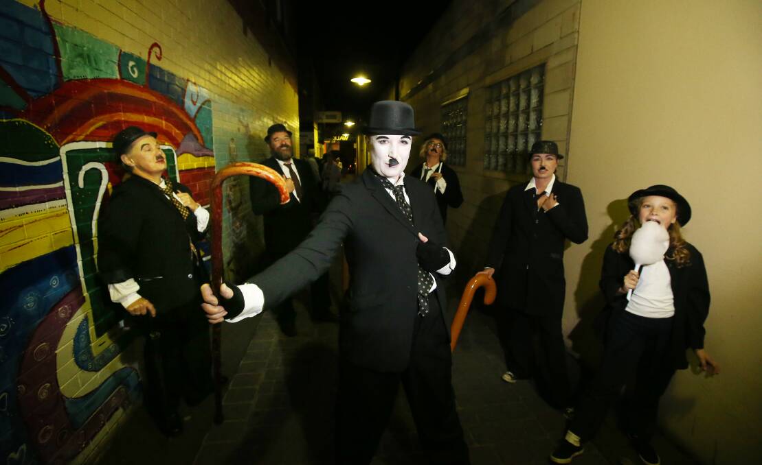 The laneways around Warrnambool’s Ozone car park were transformed into film screens for the Silver Ball Film Festival last night. Helping to promote the event were Tonia Wilcox and a supporting cast of Charlie Chaplins.
140509AS20 Picture: AARON SAWALL
