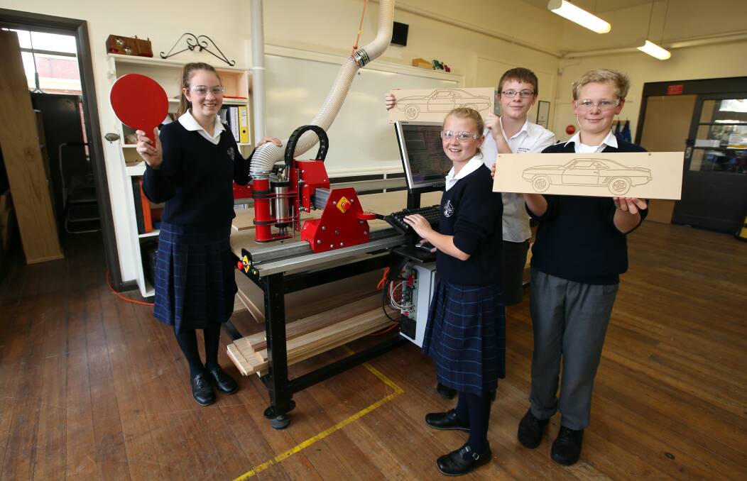 Camperdown College year 8 students Bernadette Bellman (left), 13, Sophie Sumner, 13, Paddy Mitchell, 14, and Tom Gough, 14, with the school’s new $15,000 computer router. 140514DW06 Picture: DAMIAN WHITE
