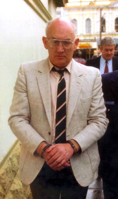 Gerald Ridsdale is led in to court in Warrnambool in 1994.