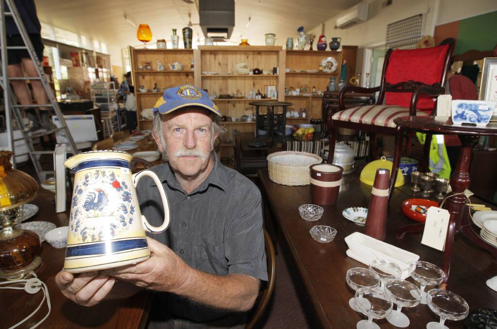 Bruce Lowenthal, from Koroit Lions Club, displays some of the items for sale at the town’s new op shop.      
150216AM02  Picture: ANGELA MILNE