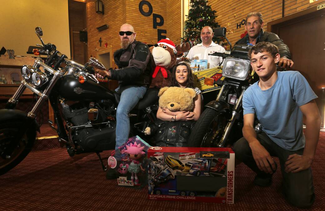 Matthew Keane (left), Nina Warnecke, 16, the Salvation Army’s Captain Darren Aitken and Trevor Warnecke, and Brad Warnecke, 14, are calling on motorbike riders to buy a gift and come on tomorrow’s toy run. 
                                                        141209RG33 Picture: ROB GUNSTONE