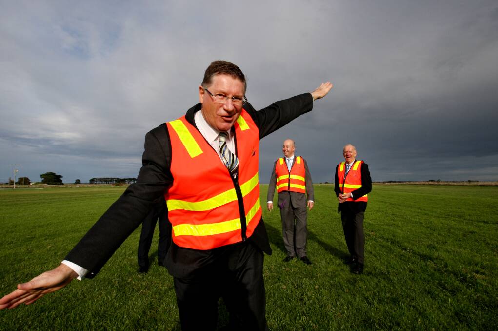 Premier Denis Napthine morphs into an aeroplane, much to the amusement of Aviation Minister Gordon Rich-Phillips and Warrnambool Airport Advisory Committee member Cr Rob Askew, at the multi-million-dollar upgrade announcement for the airport at Mailors Flat. 
140620LP11 Picture: LEANNE PICKETT