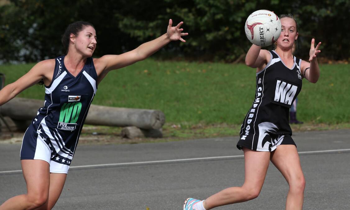 Warrnambool wing defence Sarah O’Keeffe reaches in vain to intercept a pass to Camperdown’s Amy Pemberton on Saturday.