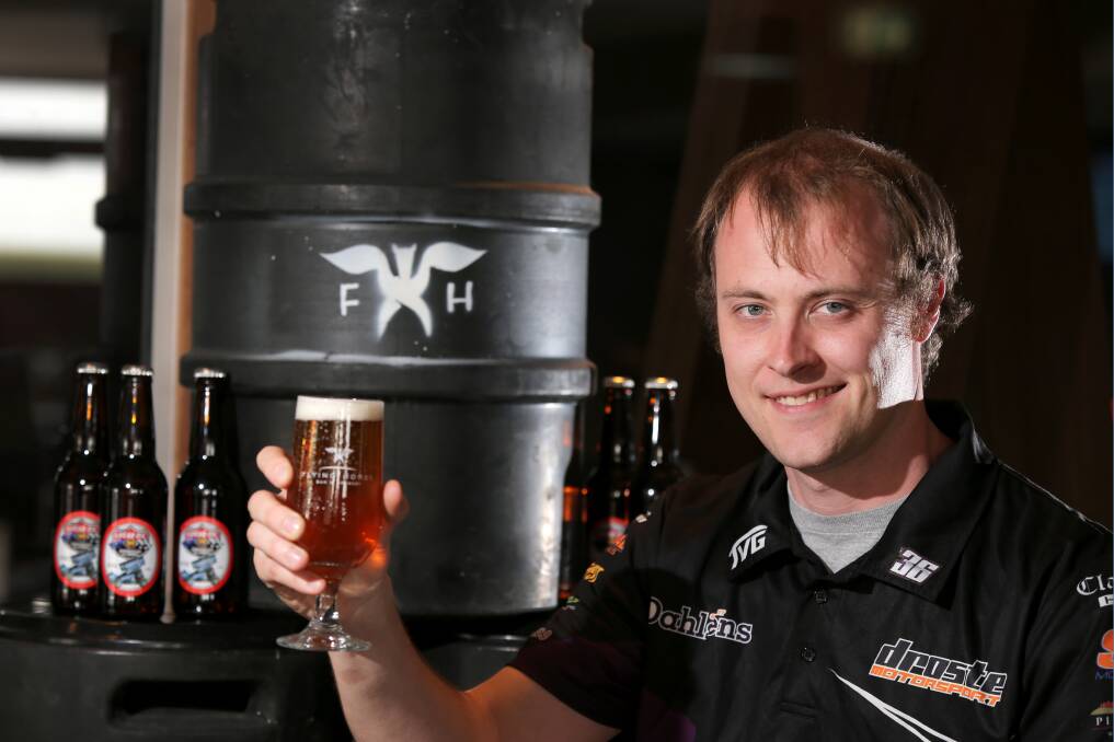 American Lucas Wolfe samples a drop of Classic Ale bearing the name of his countryman and last year’s Classic winner, Tim Kaeding, at the Flying Horse Bar and Brewery.  150120RG35 Picture: ROB GUNSTONE