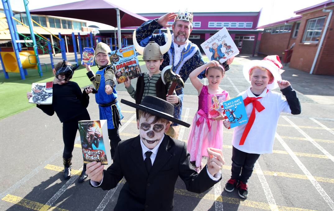 St Pius Primary School pupils and principal Peter McElgunn got into the spirit of Book Week yesterday.140828DW01 Picture: DAMIAN WHITE
