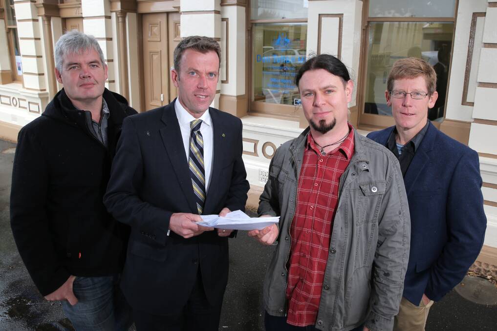 Wannon MP Dan Tehan (second from left) receives a petition from Warrnambool Baptist Church youth and outreach worker Stephen Landreth (left), Camperdown’s Joel Rothman and Warrnambool Presbyterian Church Reverend Ben Johnston. 150506RG02 Picture: ROB GUNSTONE