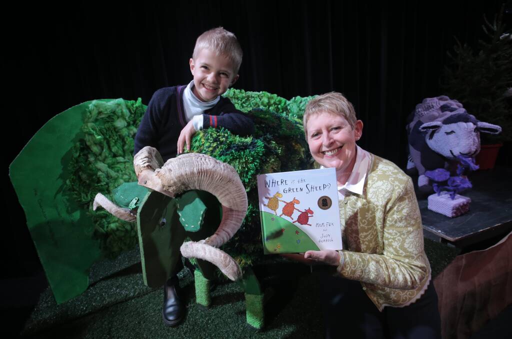 Seven-year-old Sam Walsh, from Tarrington, with children’s author Mem Fox, who read her book Where’s The Green Sheep to kindergarten, prep and grade 1 children in Hamilton yesterday. 140801VH15 Picture: VICKY HUGHSON