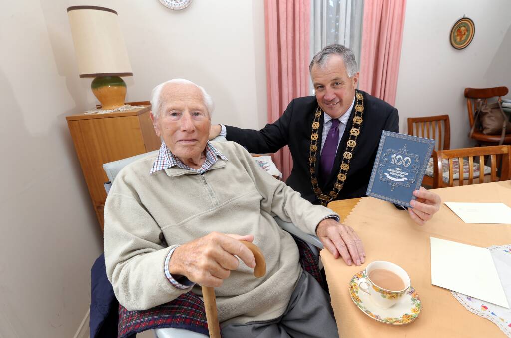 Moyne Shire Council mayor Colin Ryan visits Port Fairy resident Joe Sturdy who turned 100 this week.  150415DW06 Picture: DAMIAN WHITE