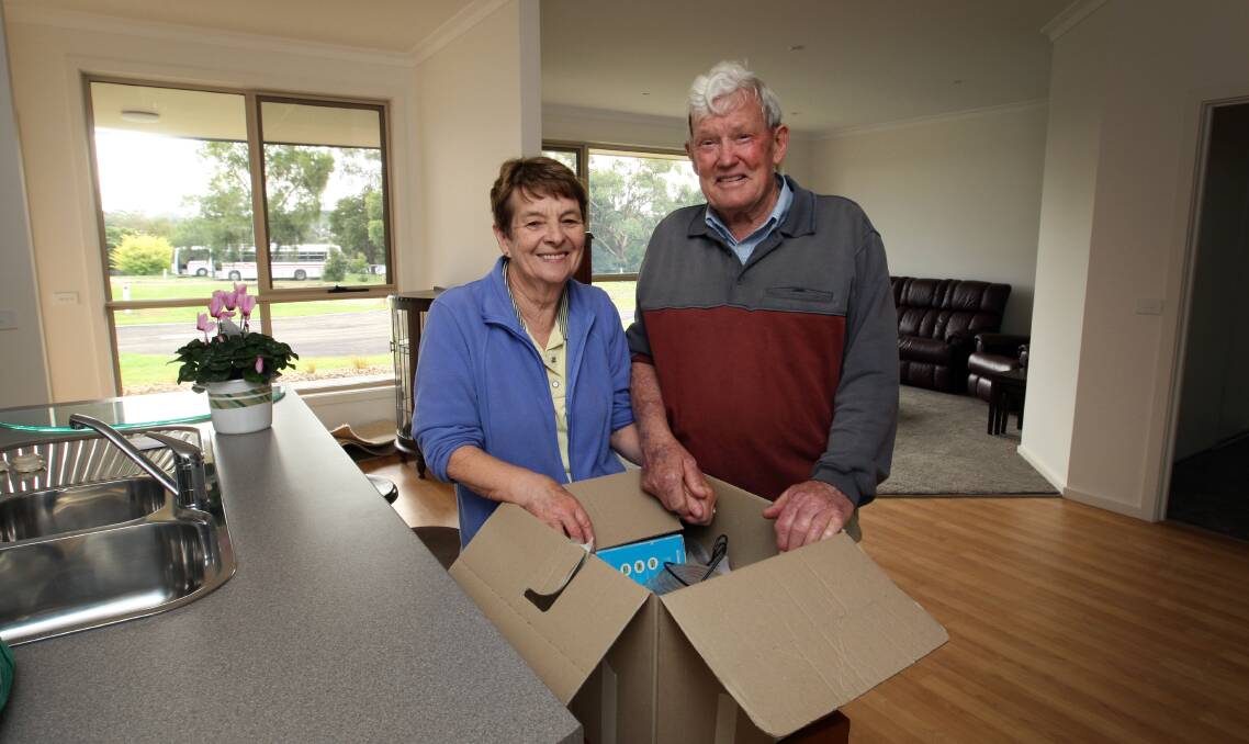 Timboon locals Nola and Max Mitchell finish unpacking yesterday at Timboon Abbeyfield. They are the first residents to move into the new independent living units at the long-awaited facility. 150401LP10  Picture: LEANNE PICKETT