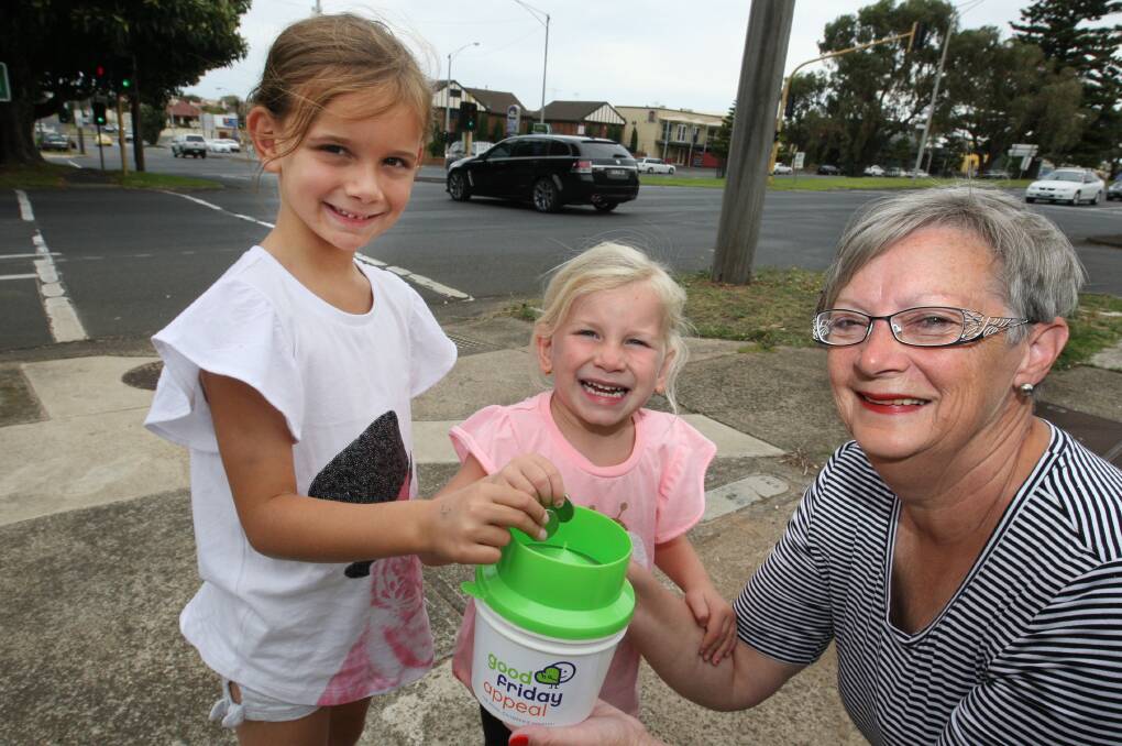 Good Friday Appeal veteran collector Judy Conn at the Banyan Street traffic lights with her granddaughters Layla Toleman-Conn, 7, and Ava Toleman-Conn, 4. 150401LP20 Picture: LEANNE PICKETT