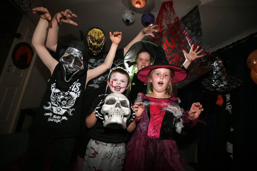 Jake Ewing, Levi Kane, Bailey Moloney, Matilda Allen and Isabella Dean celebrate Halloween in Dean’s Dungeon of Darkness —at other times the Dean family lounge room. 141031DW12 Picture: DAMIAN WHITE