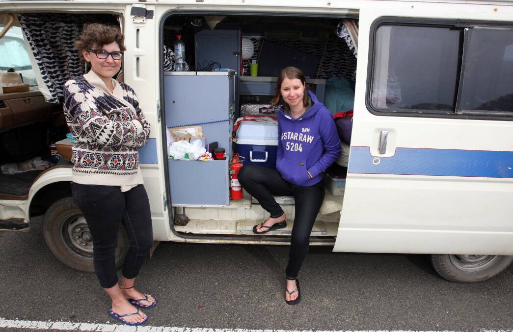 French tourists Pauline Mathe (left) and Marion Cugnet at Logans Beach car park yesterday. Hosility from passing locals was not uncommon, they said. 
150304LP05 Picture: LEANNE PICKETT